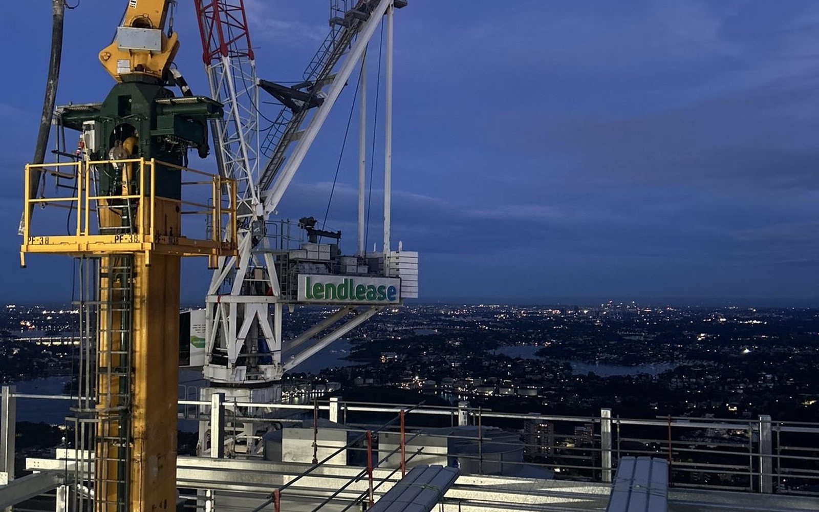 Surveying beside tower cranes at Victoria Cross, North Sydney